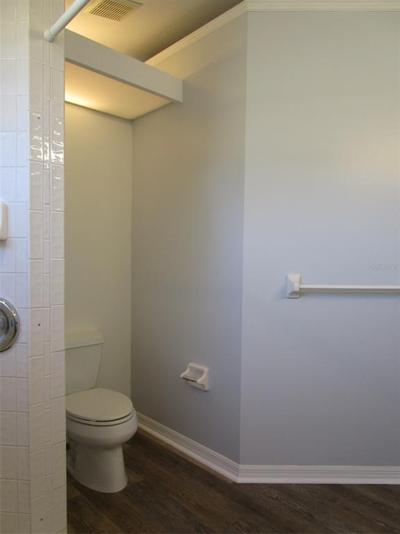 8826 Kilmer Way Hudson, FL 34667 - Photo 11 of 36 a bathroom with a toilet and a shower