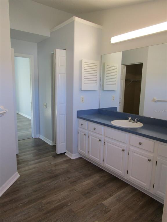 8826 Kilmer Way Hudson, FL 34667 - Photo 12 of 36 a spacious bathroom with double vanity and mirrors