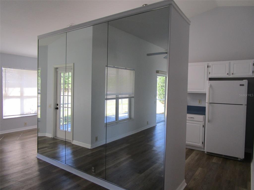 8826 Kilmer Way Hudson, FL 34667 - Photo 14 of 36 a kitchen with a refrigerator and window