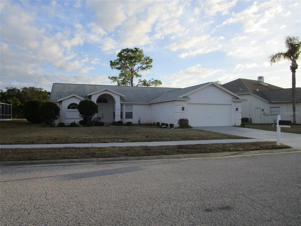 8826 Kilmer Way Hudson, FL 34667 - Photo 2 of 36 a view of a house with a yard