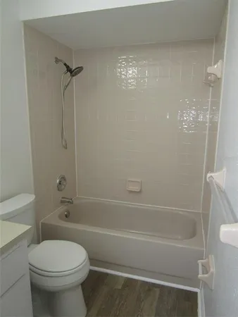 a bathroom with a shower and a toilet