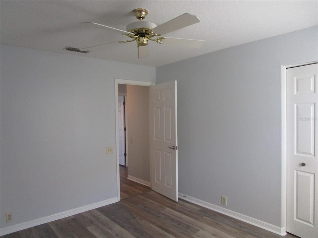 8826 Kilmer Way Hudson, FL 34667 - Photo 27 of 36 wooden floor in an empty room