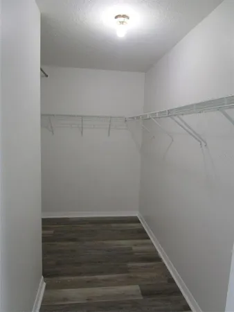 a view of an empty walk in closet