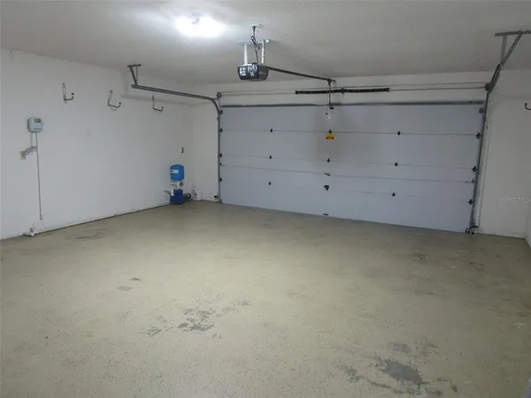 an empty room with a empty space and windows