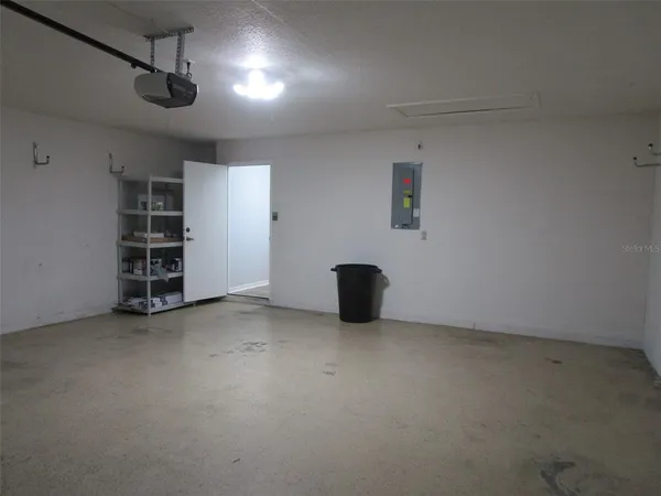 a view of an empty room with a floor to ceiling window
