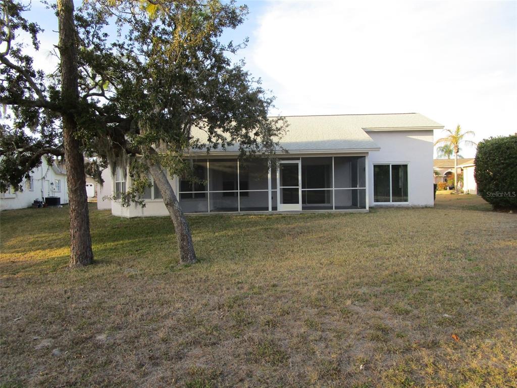 8826 Kilmer Way Hudson, FL 34667 - Photo 35 of 36 a view of a house with a backyard