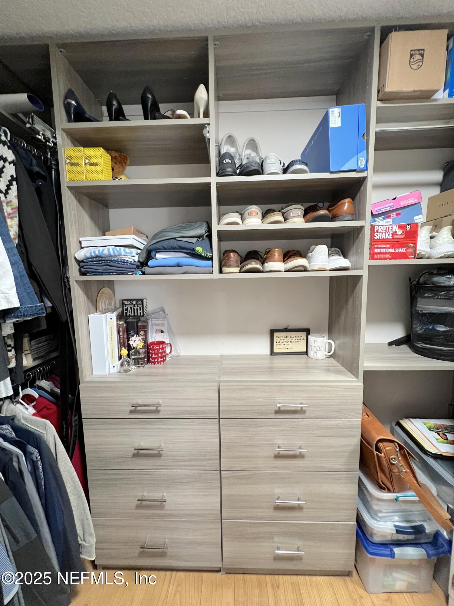 2020 Belle Grove Trace Fleming Island, FL 32003 - Photo 29 of 31 a view of walk in closet with clothes and shoes