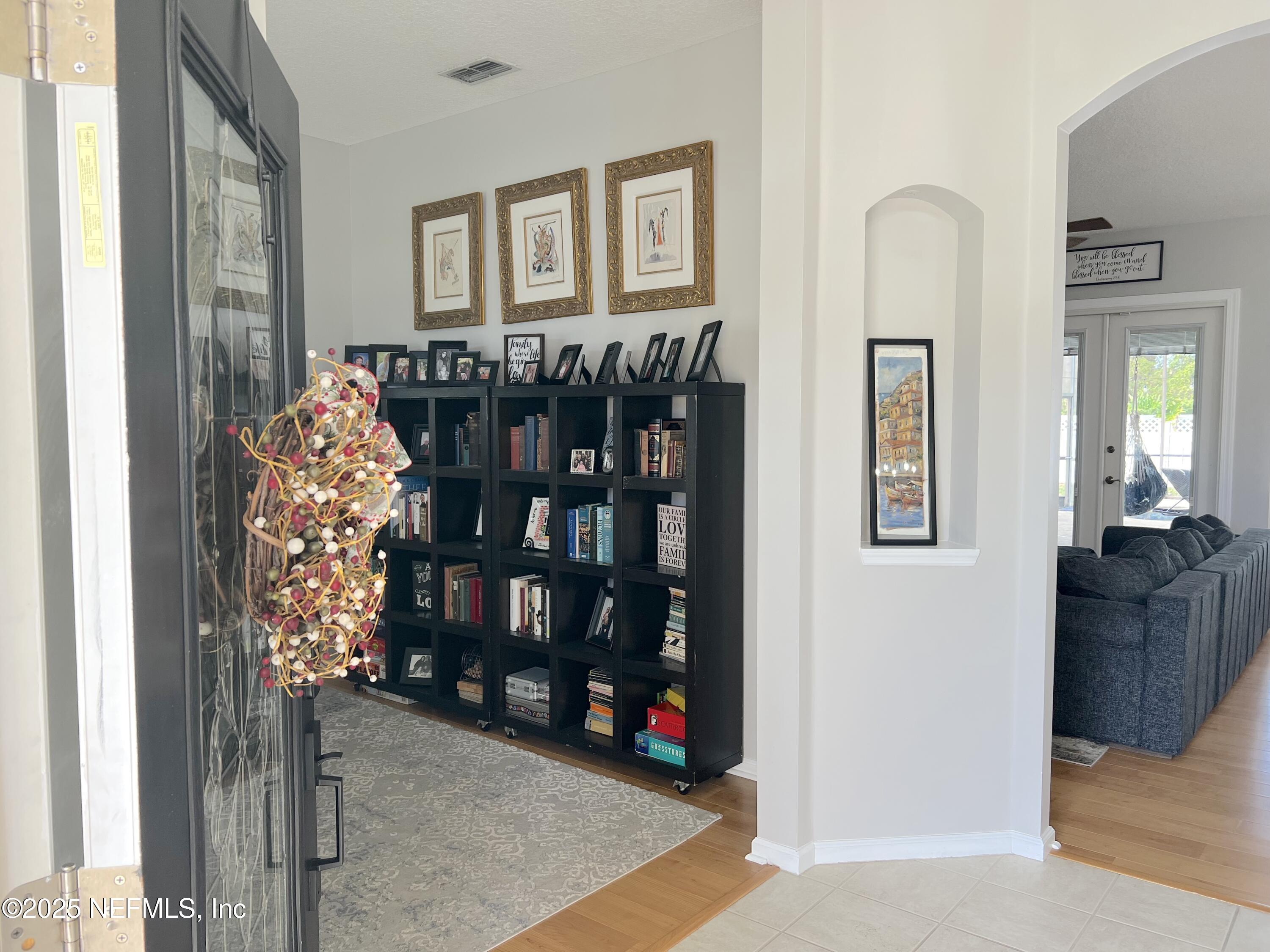 2020 Belle Grove Trace Fleming Island, FL 32003 - Photo 5 of 31 a room that has a lot of books and furniture