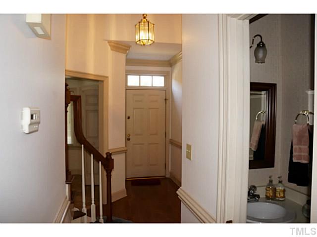 8444 Wycombe Lane Raleigh, NC 27615 - Photo 3 of 25 Shining hardwood floors and soaring ceiling are featured in this gracious sized entry foyer. The transom over the entry provides natural light!