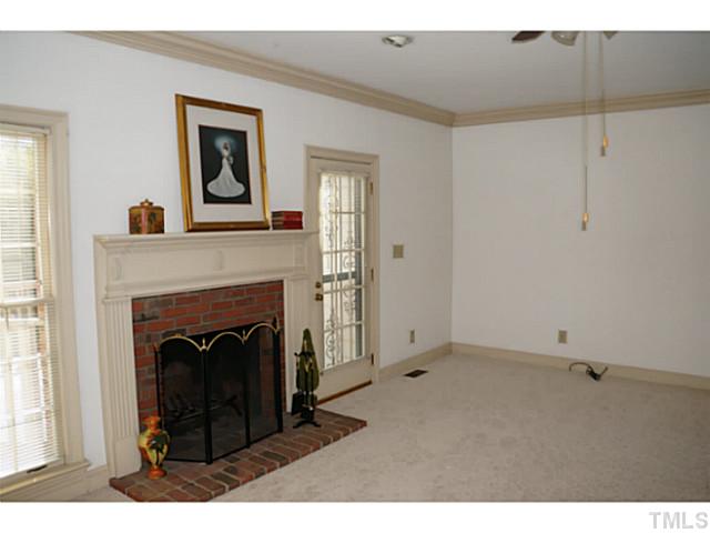 8444 Wycombe Lane Raleigh, NC 27615 - Photo 7 of 25 Floor to ceiling windows across the back of this room lets in th natural light and allows of flexibility in furniture arrangement.