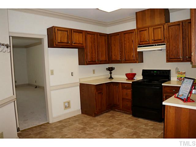 8444 Wycombe Lane Raleigh, NC 27615 - Photo 9 of 25 New flooring highlights this lovely spacious kitchen. Custom moldings & fresh paint...get out your cookbooks!