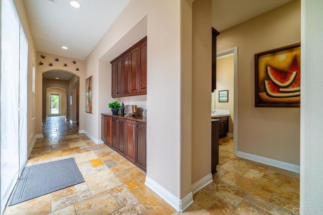 a kitchen with granite countertop stainless steel appliances and counter space