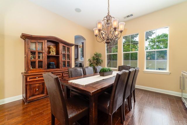 an aerial view of a residential houses with outdoor space