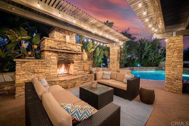a view of a patio with a table and chairs