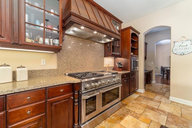 a swimming pool with outdoor seating and yard