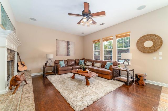 a view of a swimming pool with chairs in patio