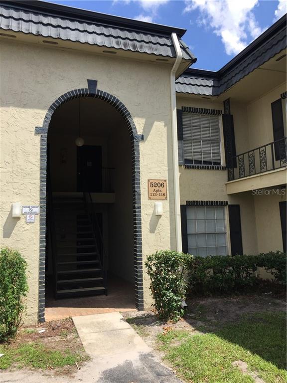5206 Curry Ford Road, Unit 11 Orlando, FL 32812 - Photo 1 of 1 a front view of a house with garden