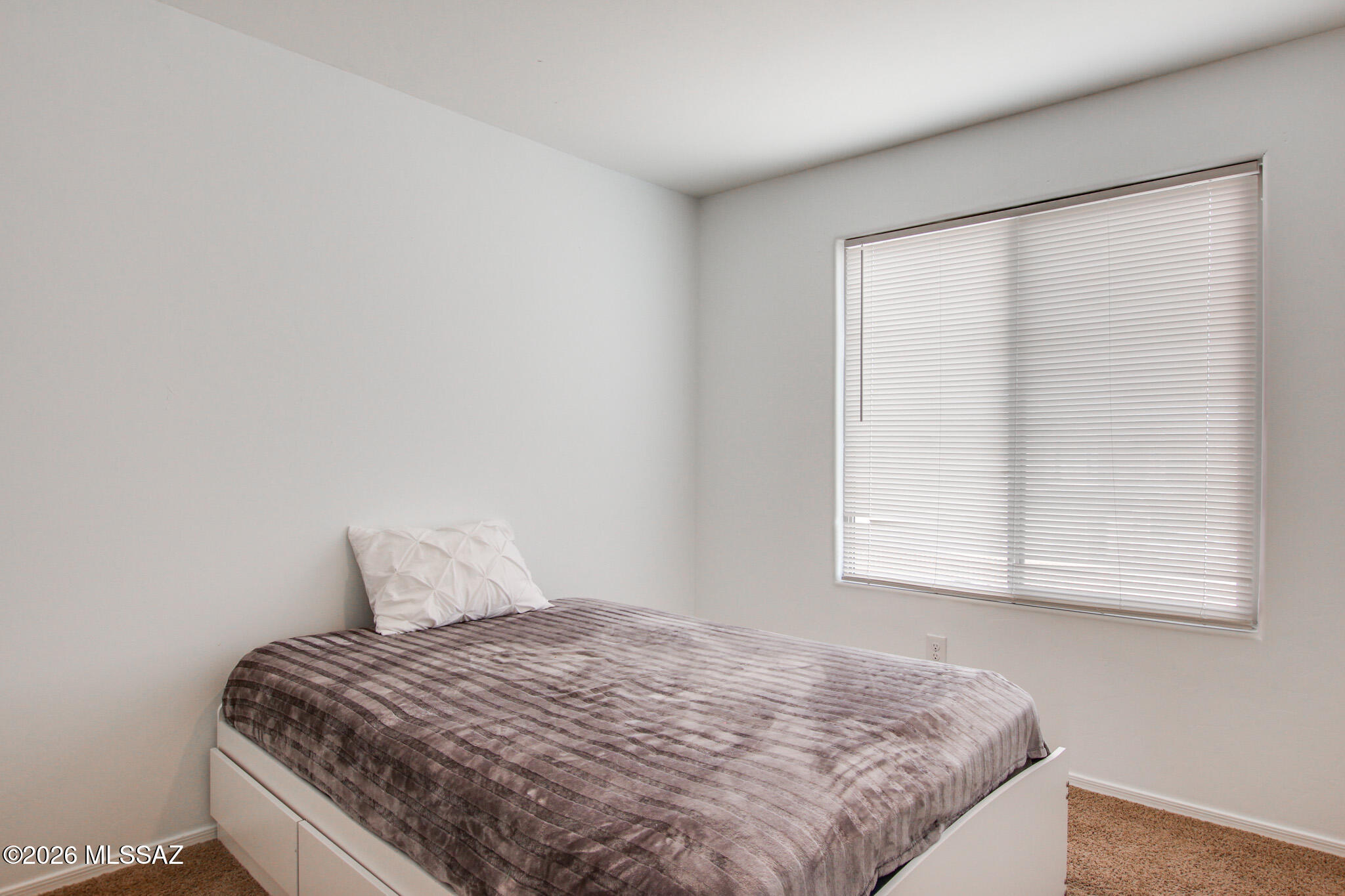 5987 South Antrim Loop Tucson, AZ 85706 - Photo 27 of 34 a bedroom with a bed and a window