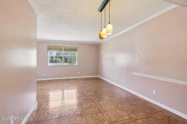 a kitchen with a refrigerator sink and cabinets