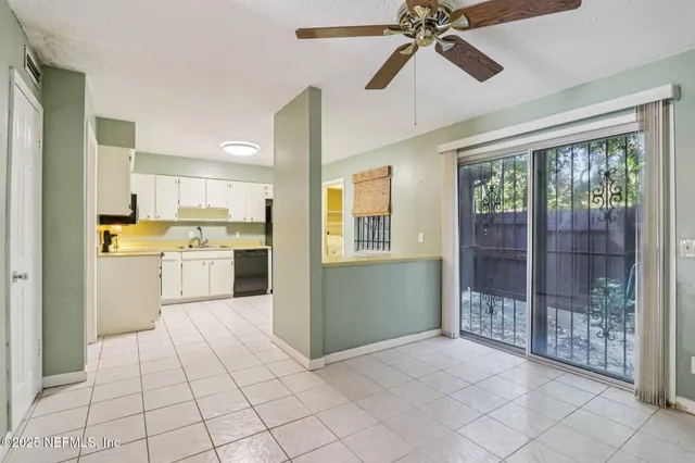 a view of a kitchen with a sink and windows