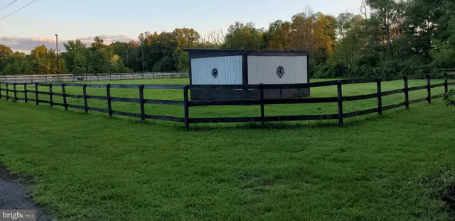 a view of a bench in front of a house