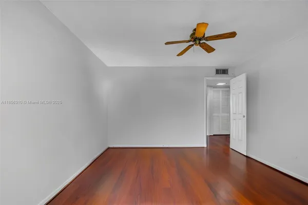 a bedroom with a bed and a table