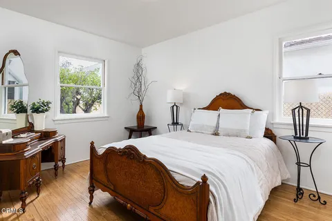 a bedroom with bed and a window