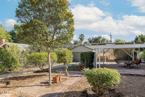 a view of a street with outdoor seating