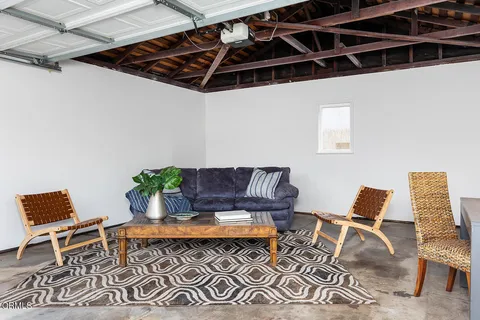 a outdoor living space with furniture and rug