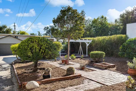 a view of a backyard with sitting area