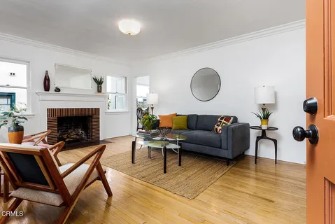 a living room with furniture and a fireplace