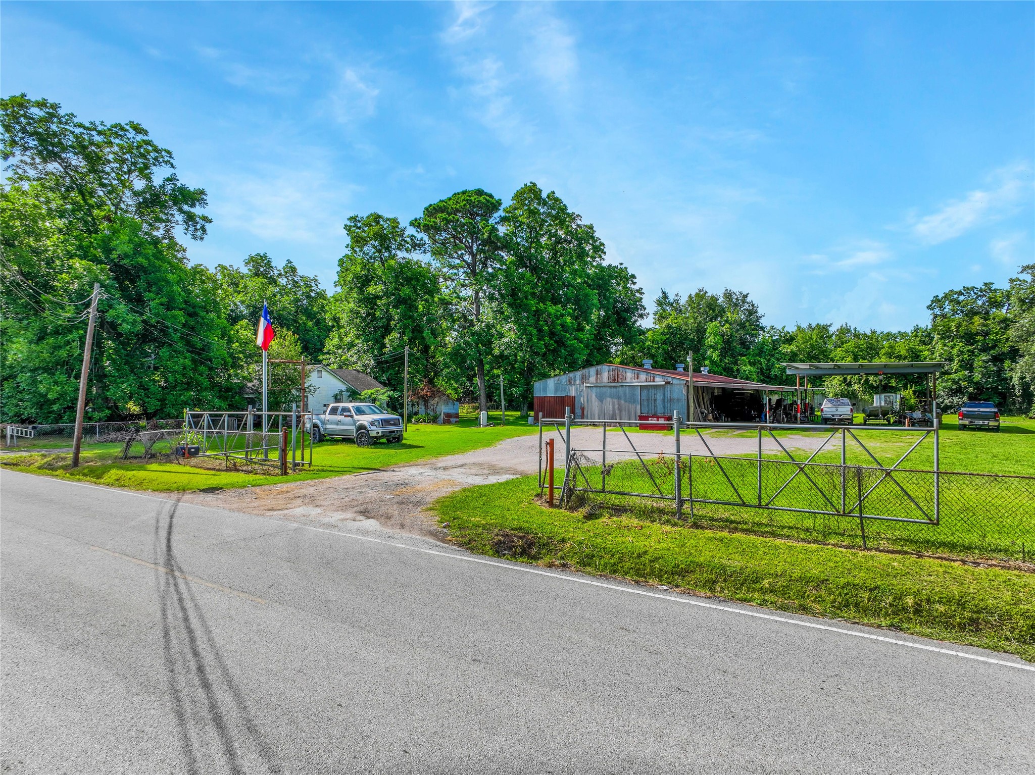 132 Hambrick Road Houston, TX 77060 - Photo 22 of 25 a view of a swimming pool with a yard and palm trees