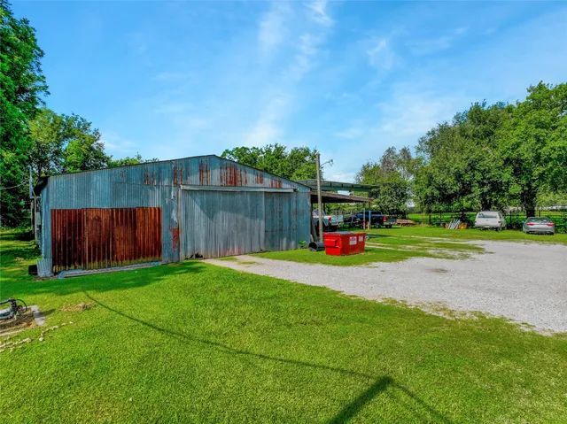 a view of house with outdoor space and deck