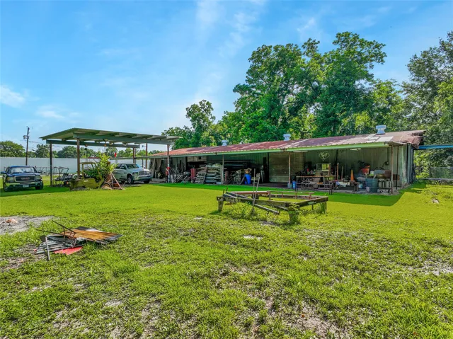 a view of a house with a big yard