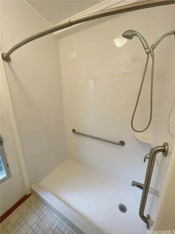 a bathroom with a toilet sink and a mirror