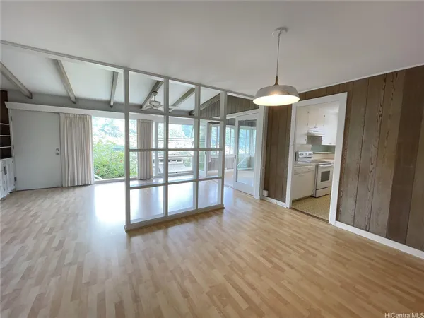 a view of room with furniture and a large window