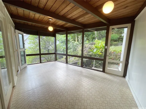 a view of an empty room with a balcony