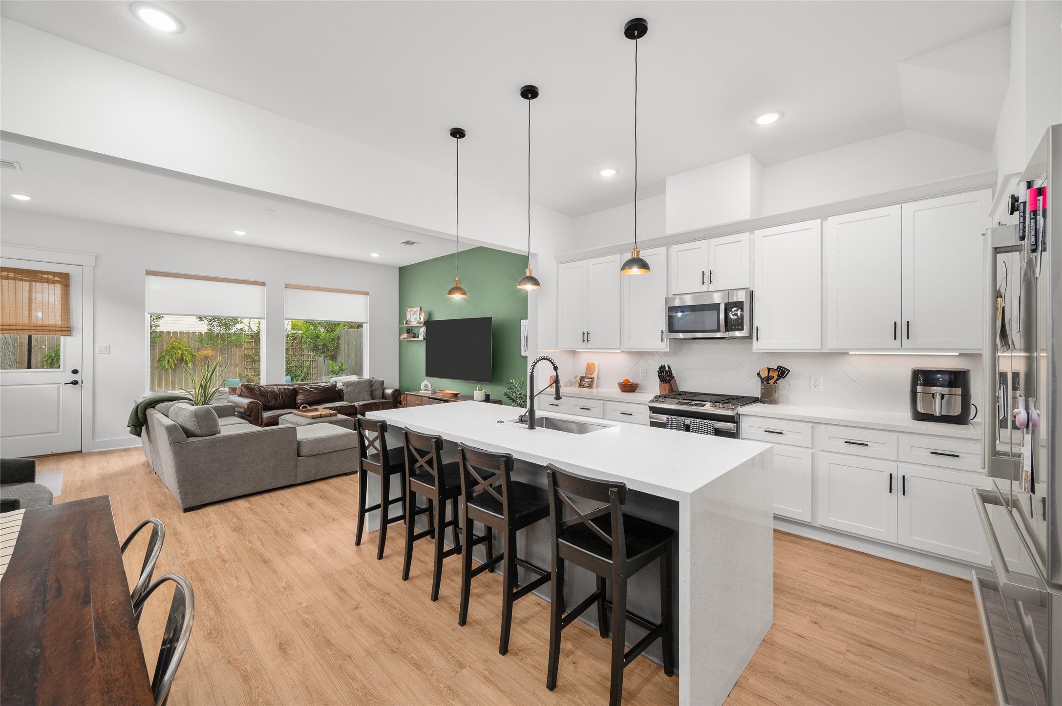 4603 Terry Street Houston, TX 77009 - Photo 10 of 41 Spacious open-concept kitchen and living area with a large island, modern appliances, and abundant natural light.