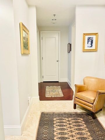a bedroom with a bed and a lamp on table