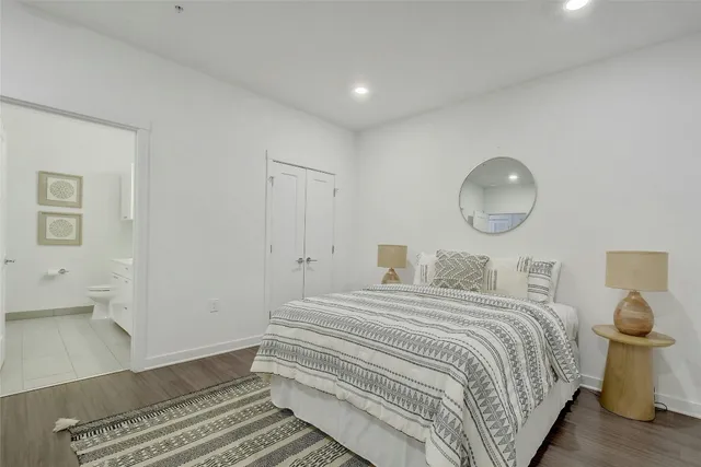 a bedroom with a bed and chair