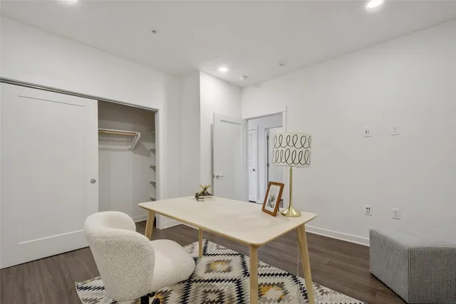 a workspace with furniture and wooden floor