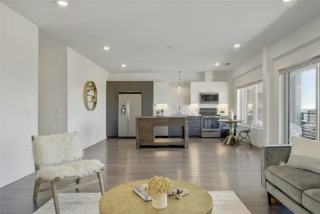 a living room with furniture a couch and a table