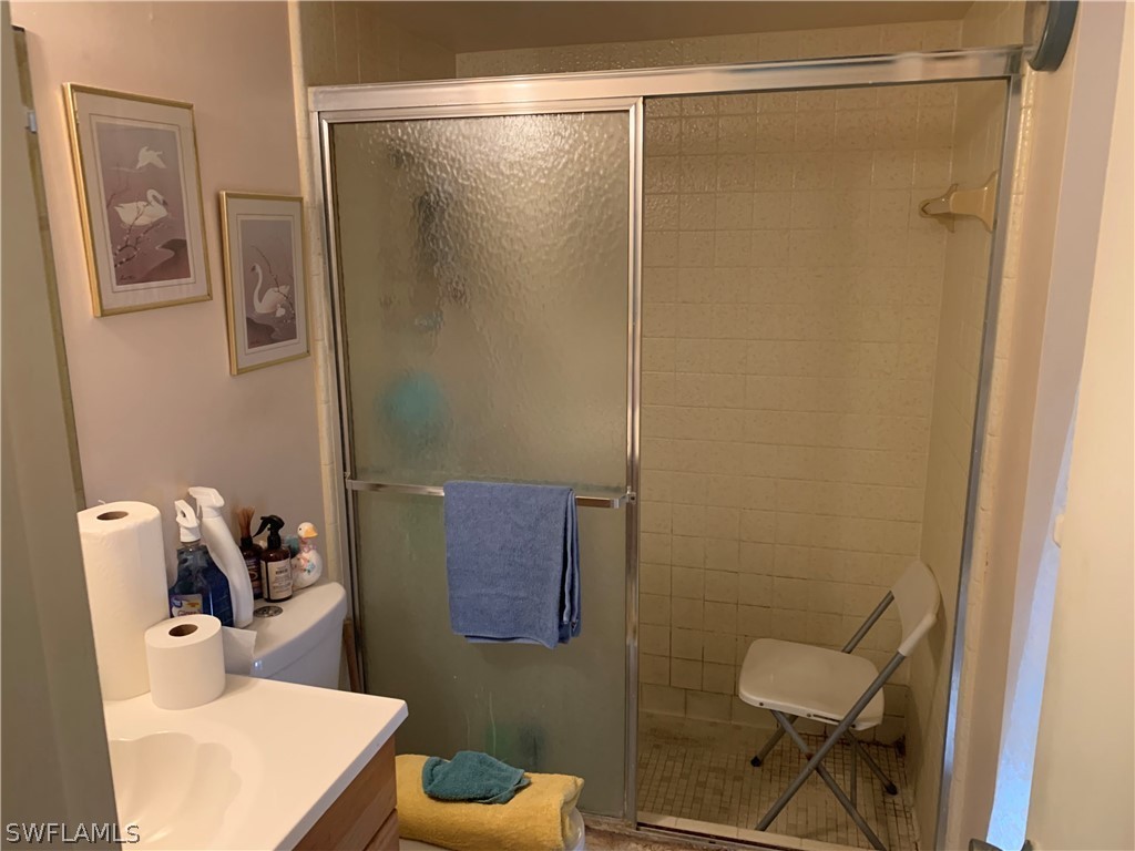 119 Rowland Road Lehigh Acres, FL 33936 - Photo 8 of 20 a bathroom with a toilet and a shower