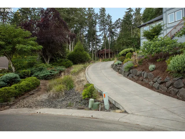 a backyard of a house with a yard and outdoor seating