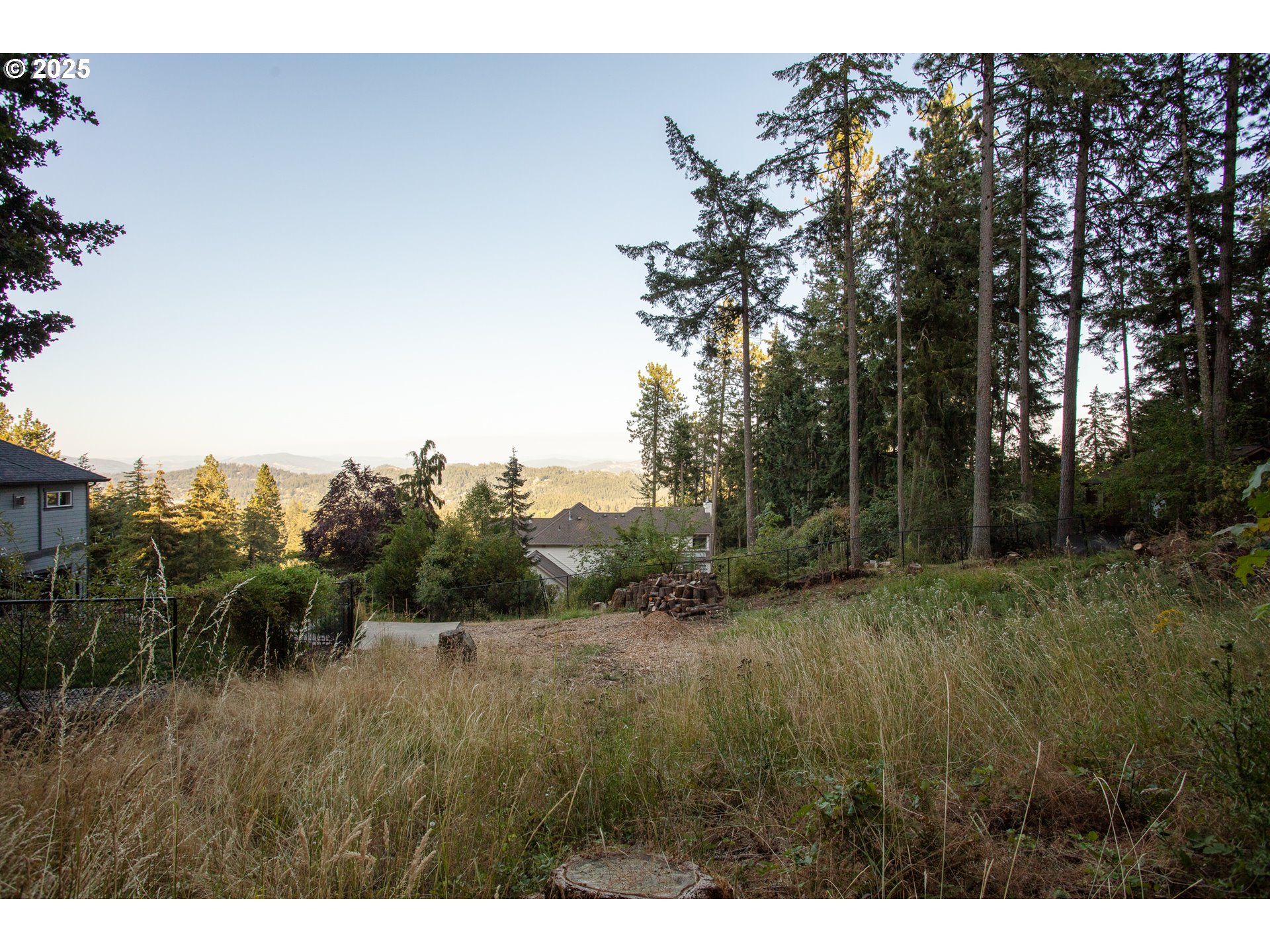 Pine View Eugene, OR 97405 - Photo 10 of 18 a view of a field of grass and trees