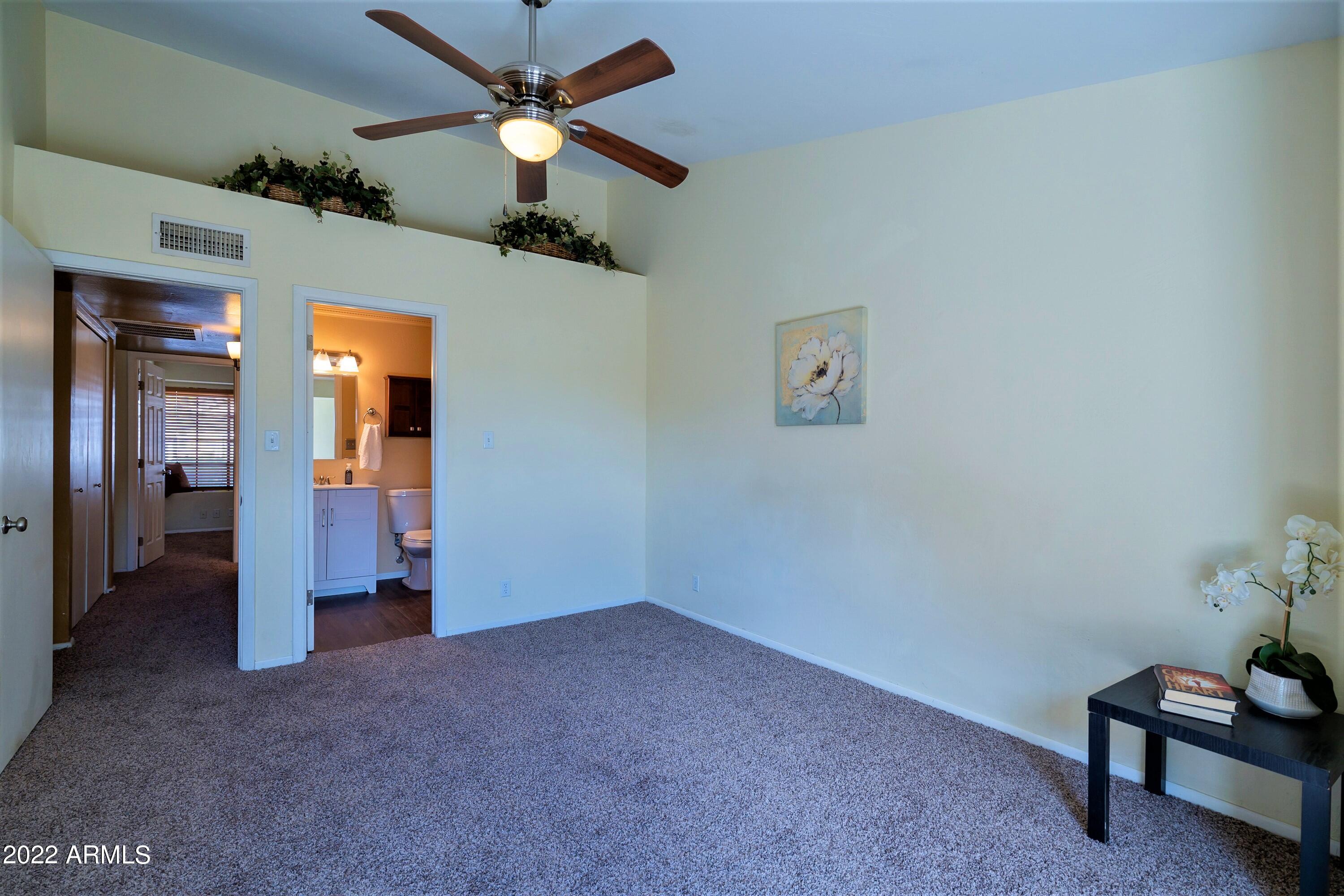 2455 East Broadway Road, Unit 19 Mesa, AZ 85204 - Photo 14 of 26 Master Bedroom and Ensuite Bathroom
