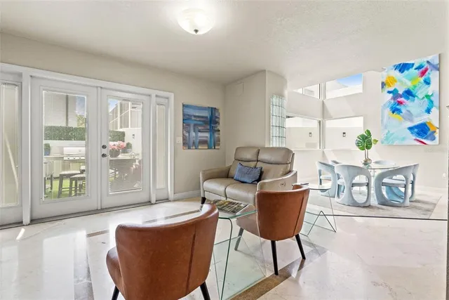 a work room with furniture and a flat screen tv