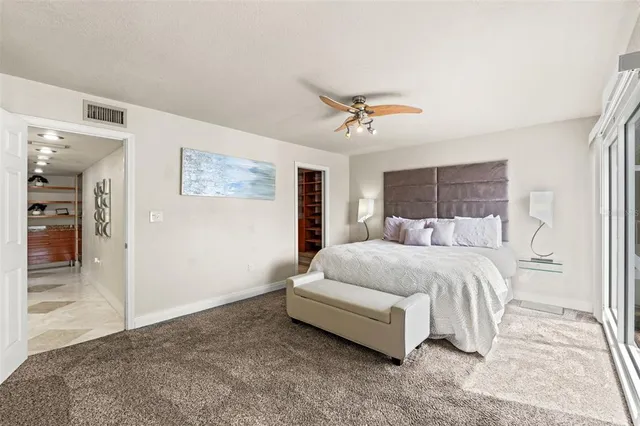 a kitchen with granite countertop sink and cabinets