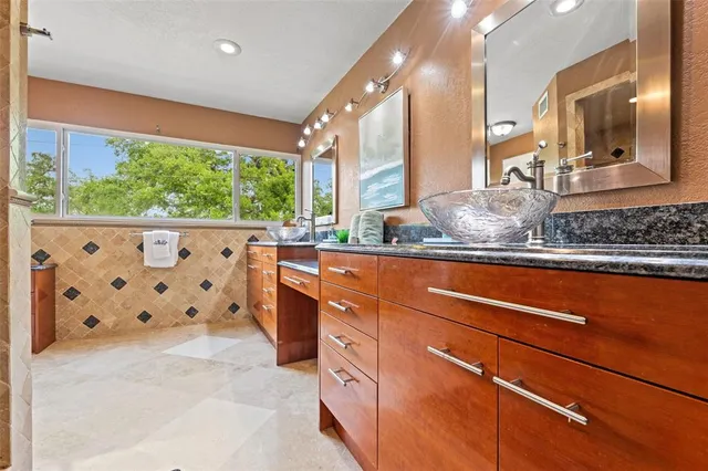a kitchen with a sink and cabinets