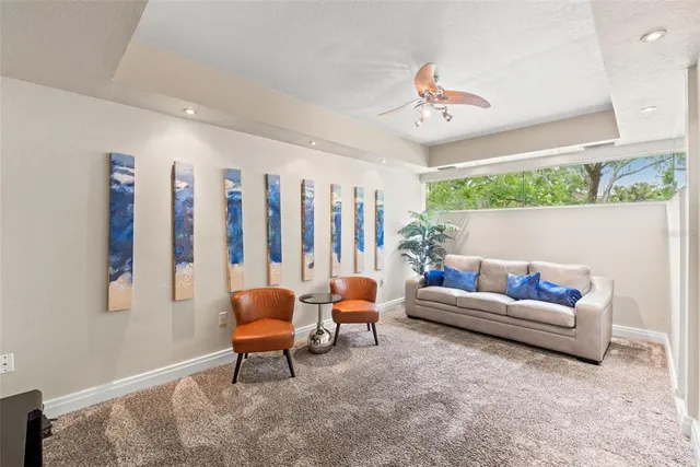a living room with furniture fireplace and a flat screen tv